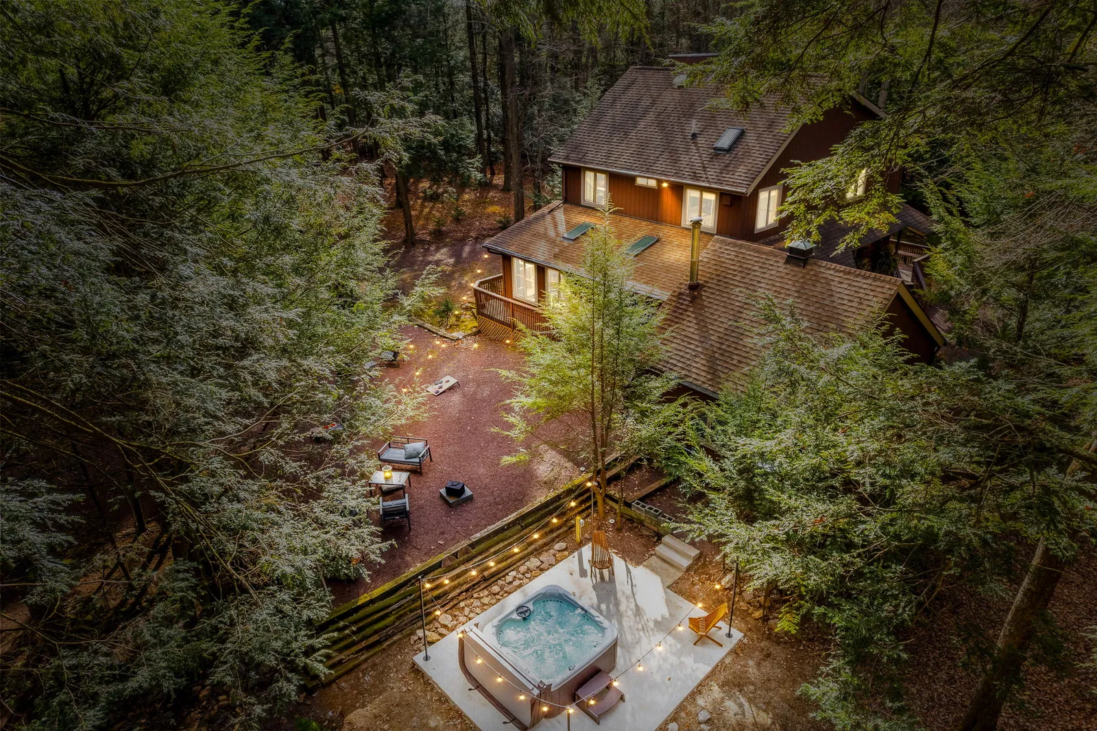 Tucked deep in the Poconos forest, with a private hot tub waiting for you! This is what escaping really looks like.