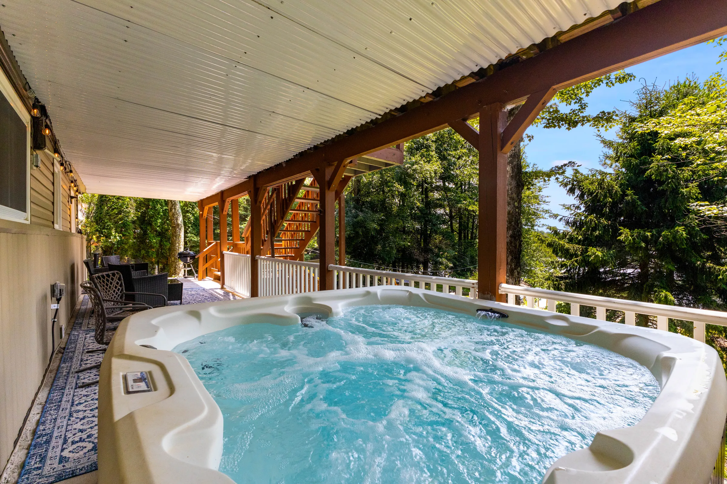 Soak in the hot tub while surrounded by peaceful woodland views.