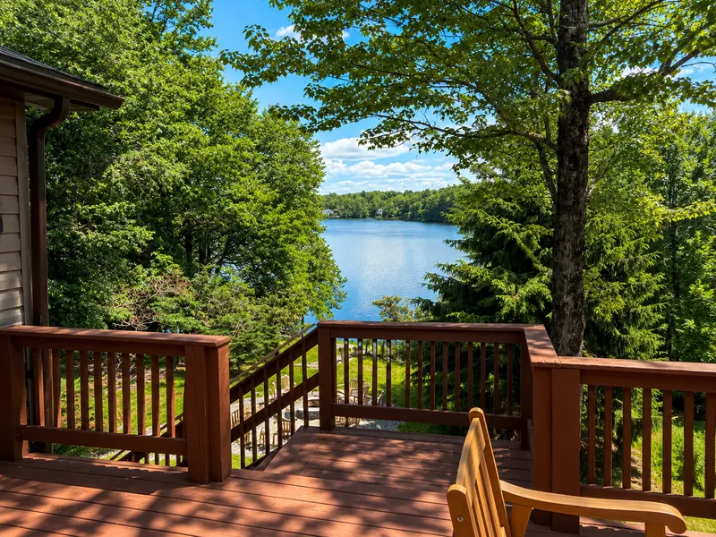Your morning coffee just found the perfect view. Unwind on the spacious deck overlooking the lake, surrounded by towering trees and peaceful nature!