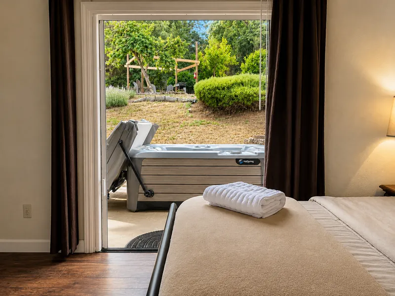 The highlight of the master bedroom? It opens up to the back patio, where you can relax in the hot tub, enjoy stargazing, or just feel nature gently coming inside. 